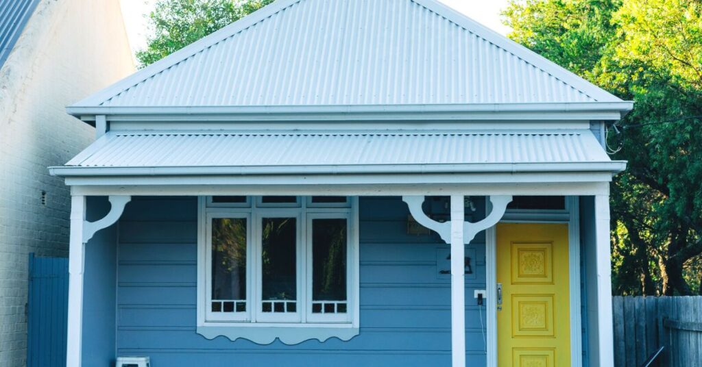 Blue cottage with yellow door