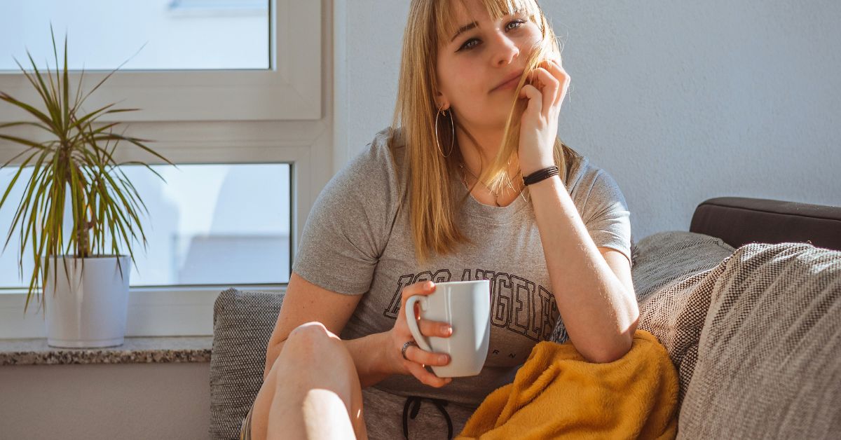 Woman-with-coffee-on-couch.jpg